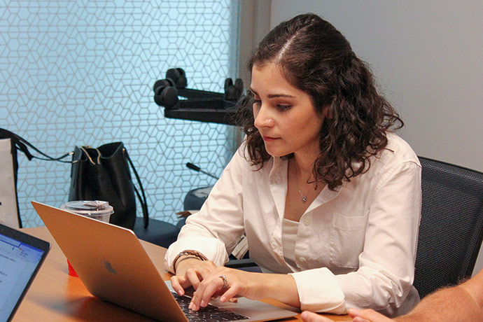 female student working on a laptop