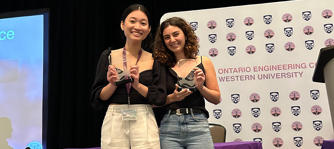 Rotem Parran and Grace Ma, both Sc’24, with award from OEC