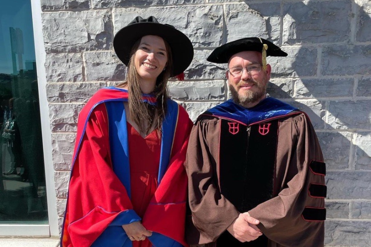 Dr. Lauren Welte and Dr. Mike Rainbow at Dr. Welte’s PhD graduation